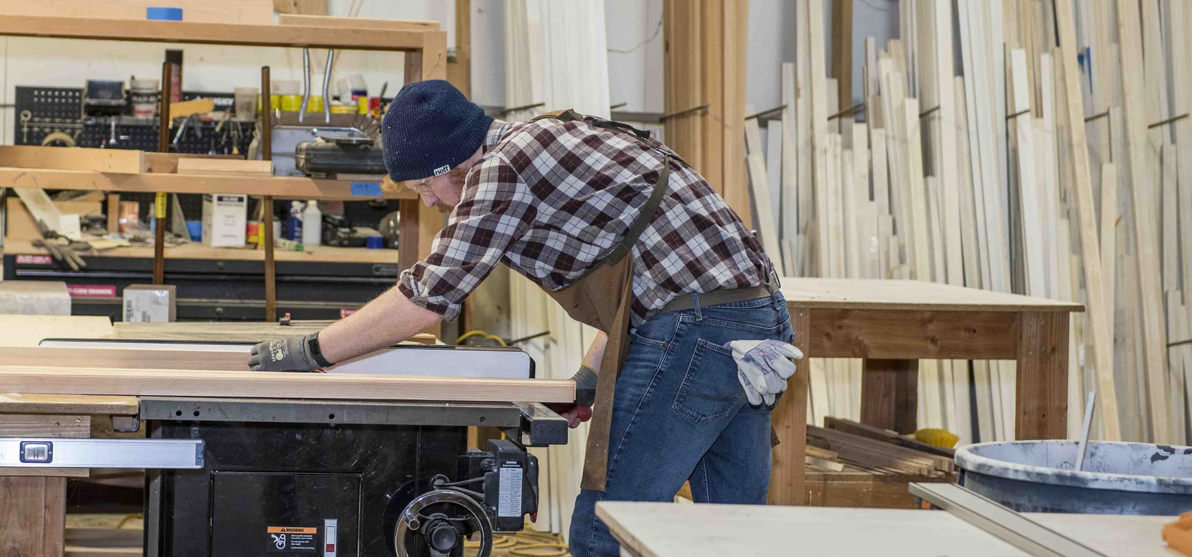 Chosen Wood Window Employee working with a table saw